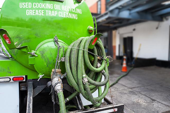 commercial kitchen grease trap being pumped out in Grove City, FL